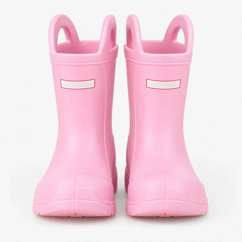 Front view of a pair of pink wellies with two pull-on handles, studio shot on a plain white background. 2