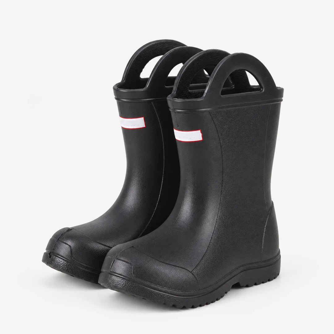 Black wellies with handles shown at a three-quarter angle, revealing the side profile, toe cap and chunky tread sole. 5