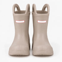 Front view of a pair of beige wellies with pull-on handles and toe caps, studio shot on a white background. 7