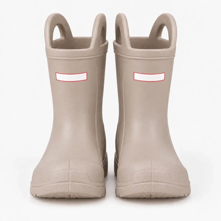 Front view of a pair of beige wellies with pull-on handles and toe caps, studio shot on a white background. 7