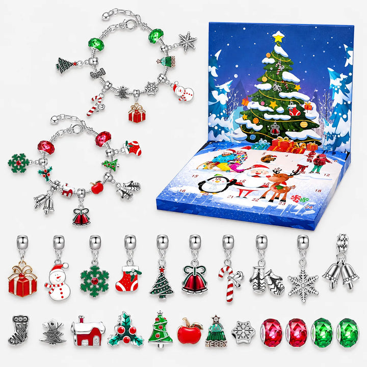 Flat lay of the open advent box, two assembled charm bracelets and all loose Christmas charms and red and green beads laid out in rows. 2