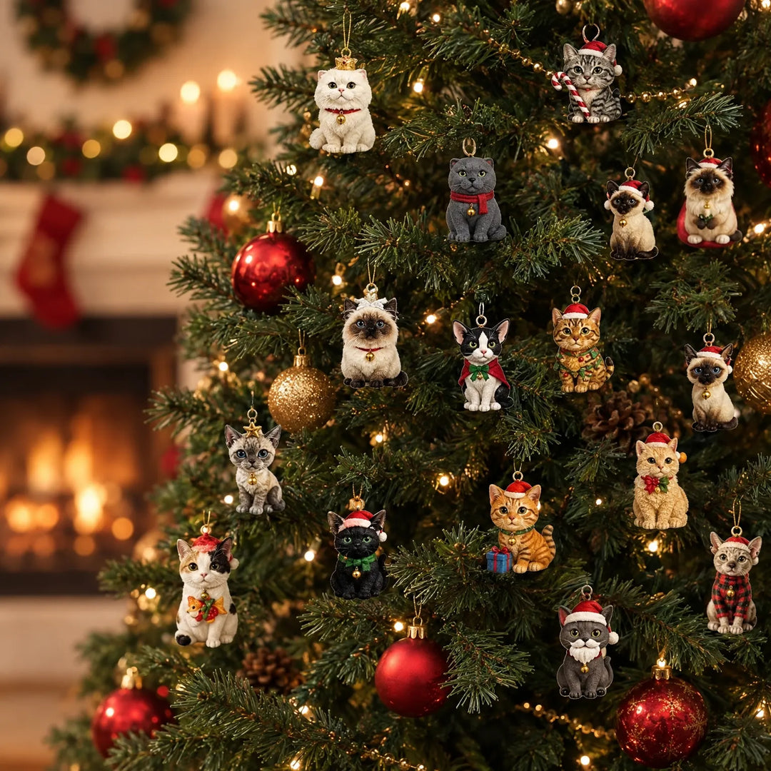 Many small cat ornaments in Santa hats and scarves hanging on a lit Christmas tree, with a fireplace glowing behind. 1