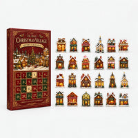 Red and green advent calendar box with numbered doors standing beside all 24 miniature village building ornaments arranged in four rows on white. 2