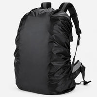 Black cover fitted over a rucksack on a plain light background, shown from the side with the shoulder straps visible. 2