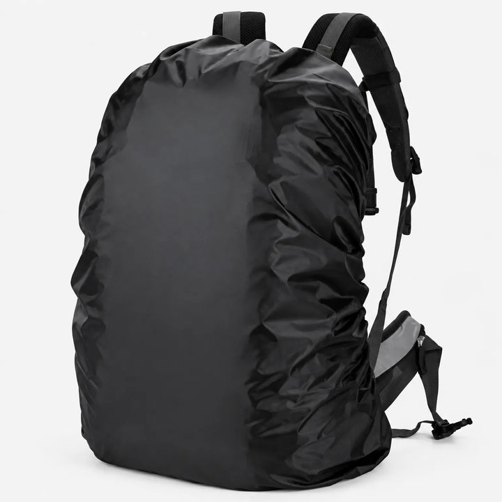 Black cover fitted over a rucksack on a plain light background, shown from the side with the shoulder straps visible. 2