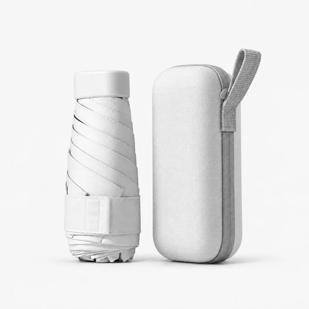 White folded umbrella with cap and strap beside a matching white hard zippered case with a grey wrist loop, on a white background. 10