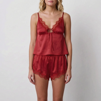 Front view of a model wearing the set in deep red satin with matching red lace trim and bow tie. 8