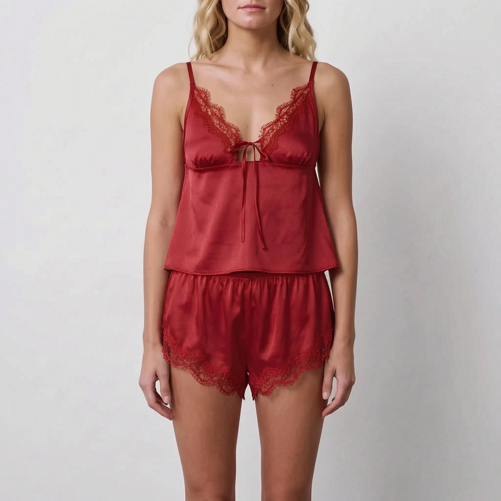Front view of a model wearing the set in deep red satin with matching red lace trim and bow tie. 8