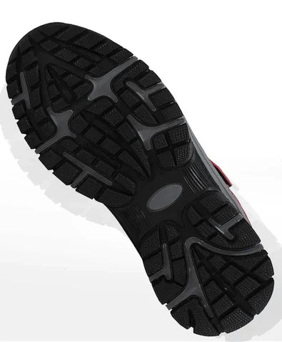 Underside of the boot showing a deep black and grey lugged outsole for grip 3
