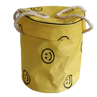 Large foldable toy tidy-up mat with basket function for the children's room.