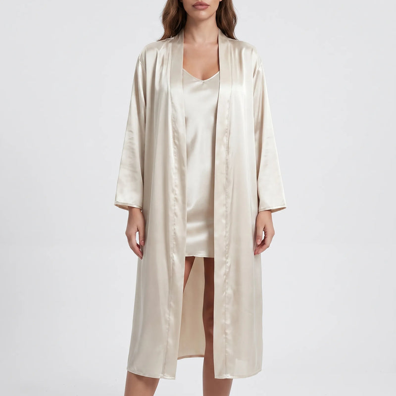 Model wearing the champagne-beige version of the satin robe and slip dress set, front view on a light background. 6