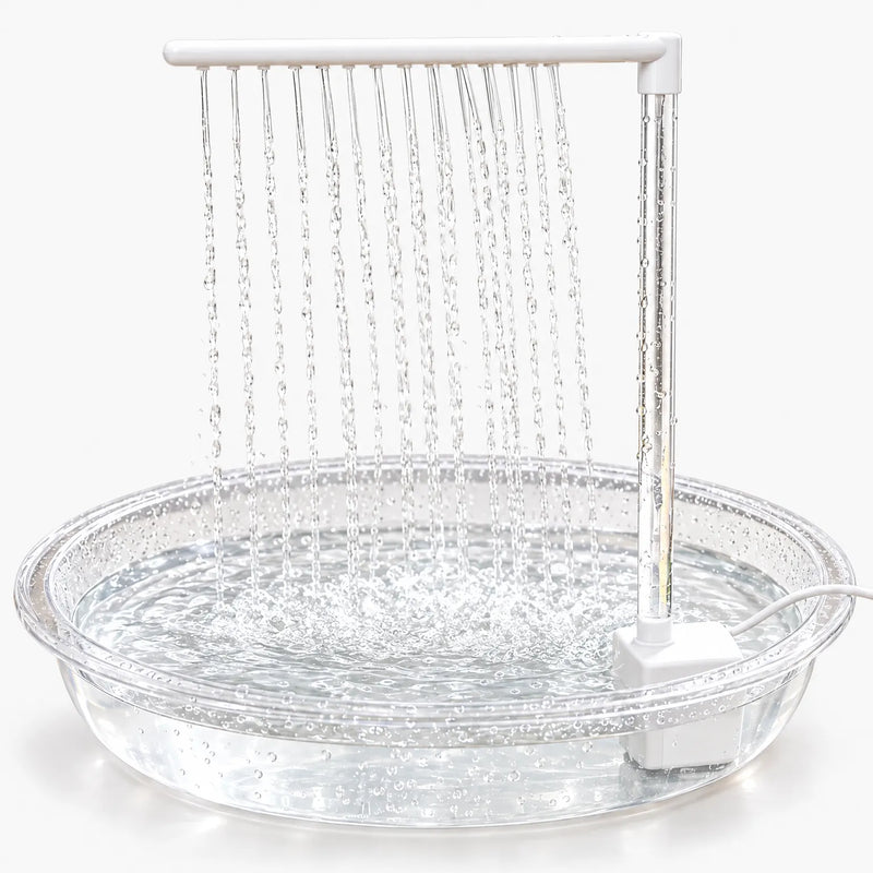Clear shallow bath with a white pump and overhead bar, rows of water streams falling into the filled dish against a plain white background. 1