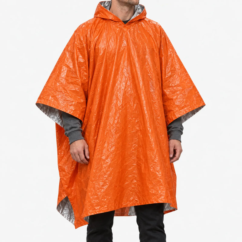Man wearing the hooded orange poncho, front view against a plain white background, with its shiny silver lining showing at the edges. 2