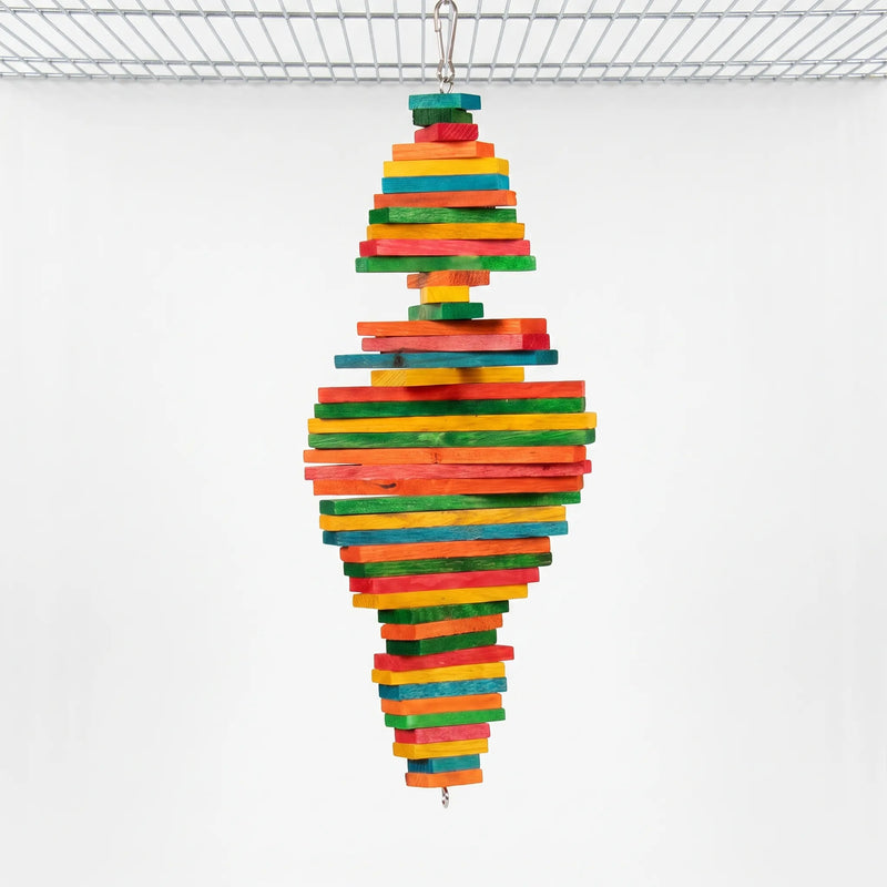 Hanging toy of many brightly coloured wooden slats stacked in a spiralling diamond shape, clipped to a wire cage roof against white. 1