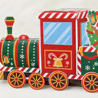 Close-up of the locomotive and cab, showing the striped boiler, golden bell artwork, blue window and spoked wheels in red, green and gold. 3