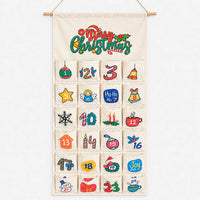Cream canvas version with 24 hand-drawn style festive pockets, hung from a wooden dowel and twine, shown front-on against a plain background. 3