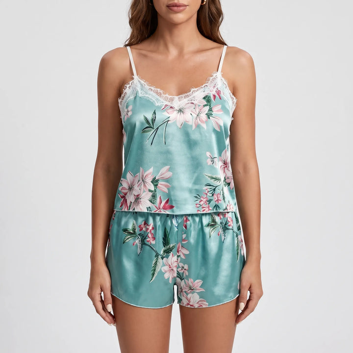 Studio front view of the floral cami and shorts set worn by a model against a light grey background. 6