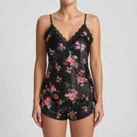 Black version of the satin cami and shorts set with pink rose print and black lace trim, worn by a model. 7