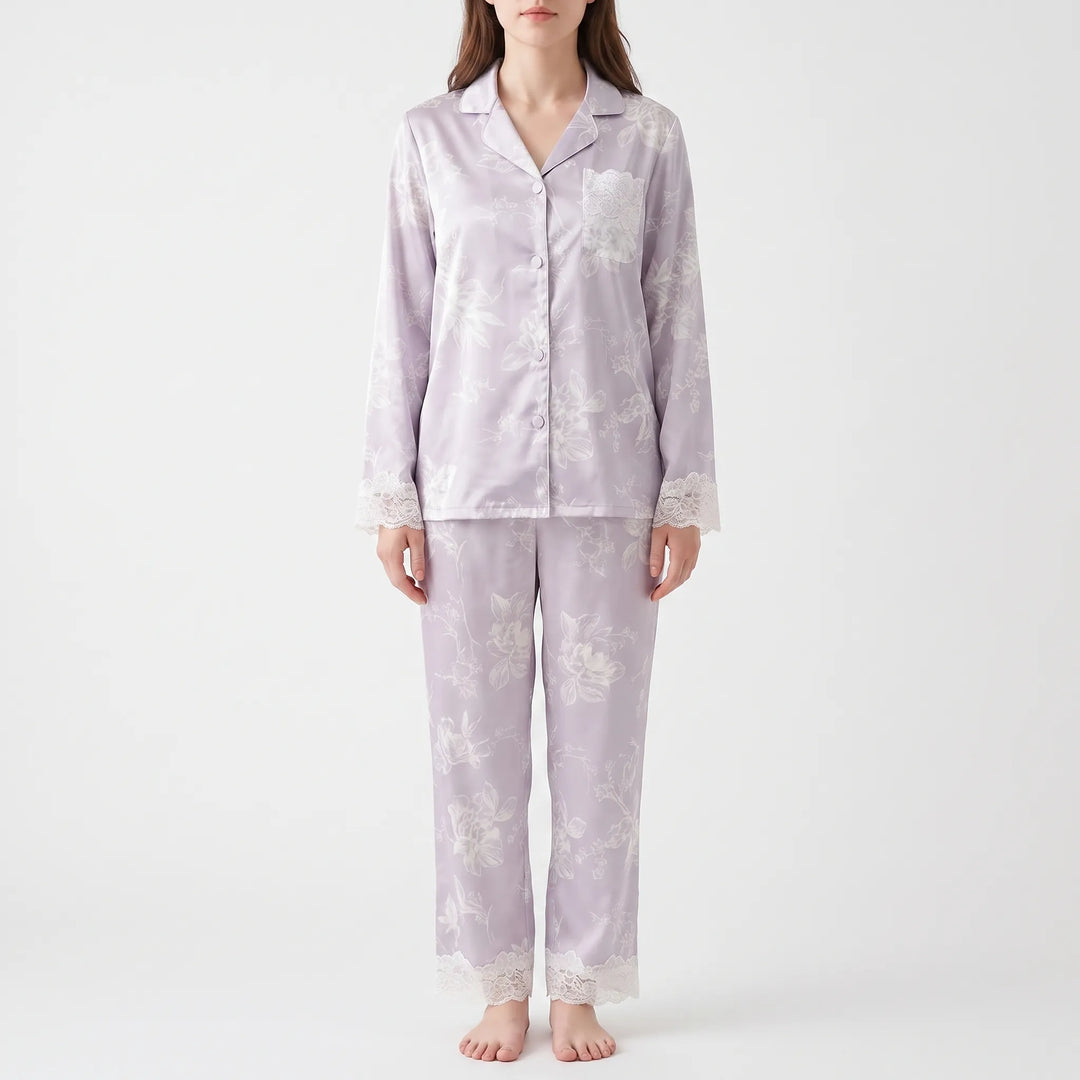 Second front view of the model in the lilac floral pyjamas, showing the lace pocket, lace cuffs, and lace trouser hems. 4