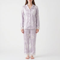 Second front view of the model in the lilac floral pyjamas, showing the lace pocket, lace cuffs, and lace trouser hems. 4