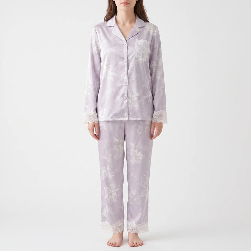 Second front view of the model in the lilac floral pyjamas, showing the lace pocket, lace cuffs, and lace trouser hems. 4