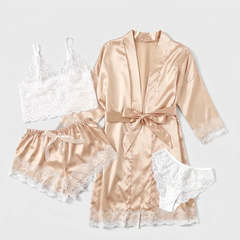 Flat lay of the four pieces: lace bralette, satin shorts with lace hem, belted satin robe and white lace briefs. 5