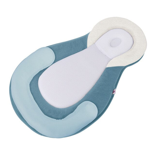 Ergonomic portable baby bed with head support to prevent flattening of the head – Sleep Cocoon