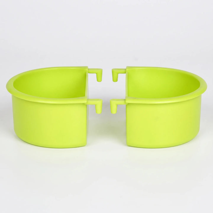 Two green plastic half-round bowls with hook-shaped hangers, shown side by side against a plain light background. 1