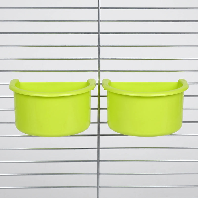 Two green half-round bowls hanging side by side on the metal bars of a cage, seen from the front. 4