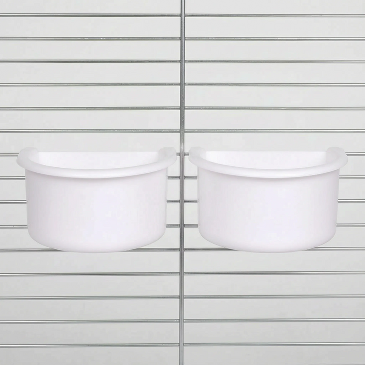 Two white half-round bowls hanging side by side on cage bars, the white version of the same design. 5