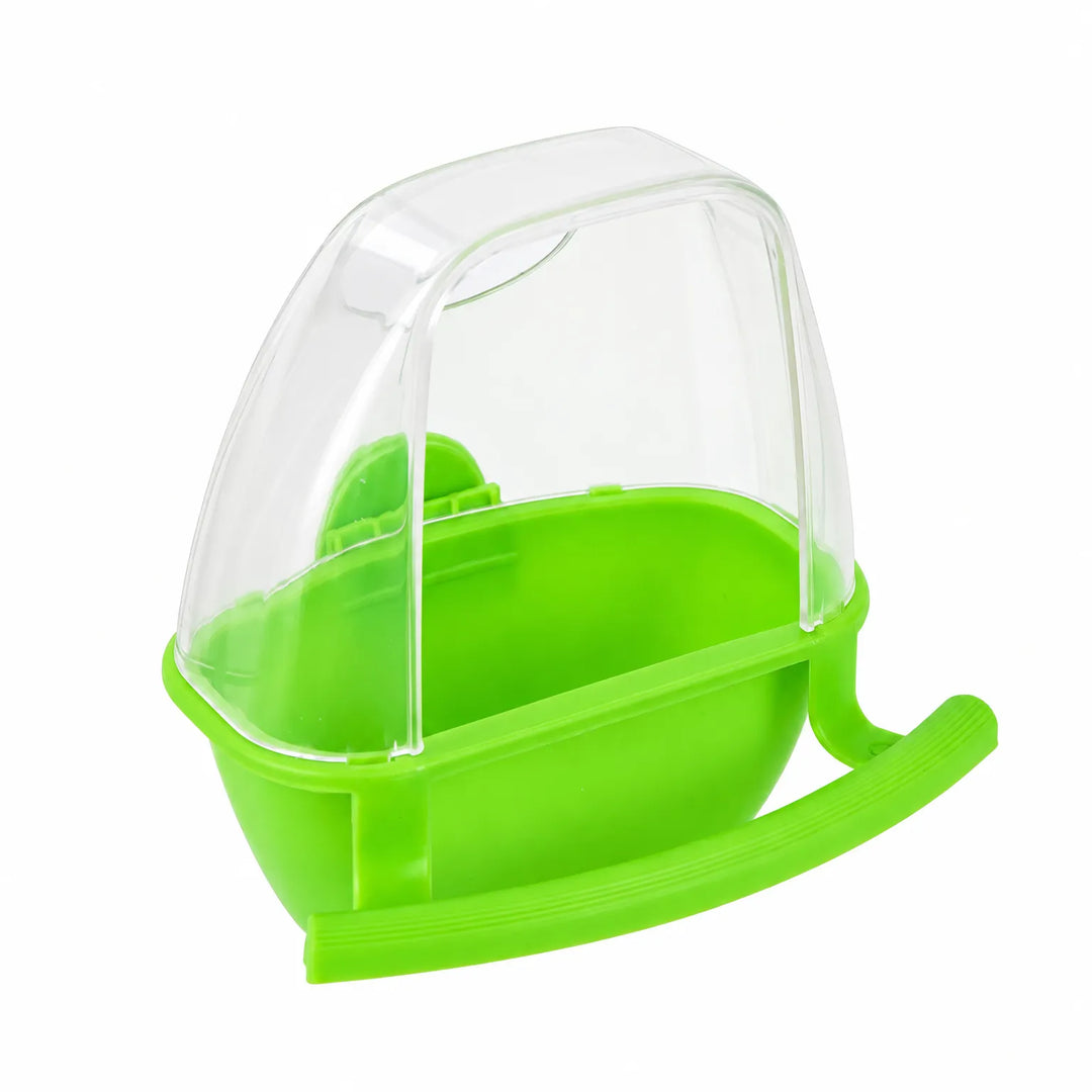 Green feeder viewed from the front on white, showing the open bowl under the transparent cover and the perch. 4