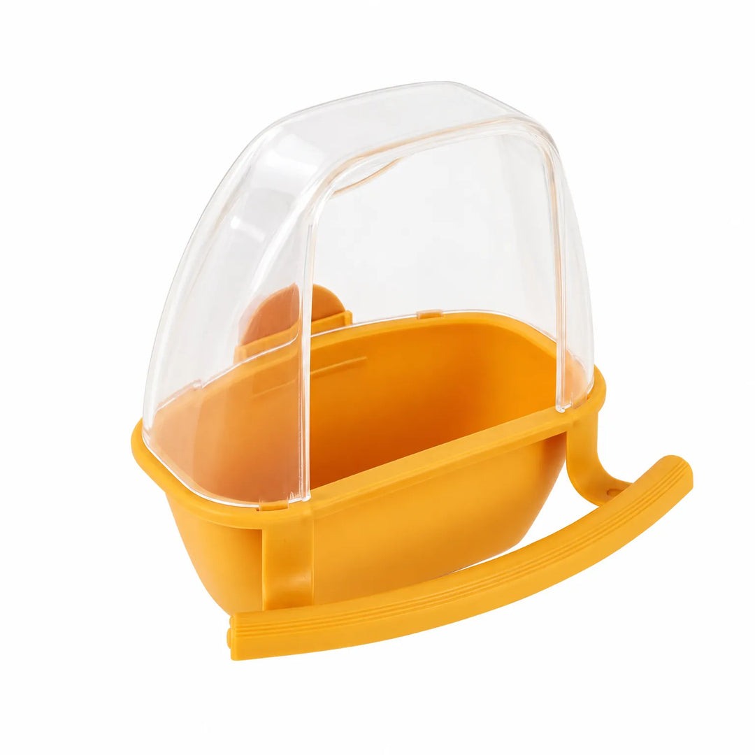Orange-yellow feeder with a transparent hood and curved perch, shown on a plain white background. 5