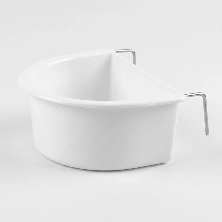 White plastic D-shaped bowl with two bent metal hooks on its flat side, shown on a plain light background. 1