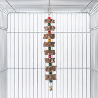 Hanging bird toy with bark-edged wooden slices, colourful beads and a small gold bell, hooked inside an empty wire cage. 1