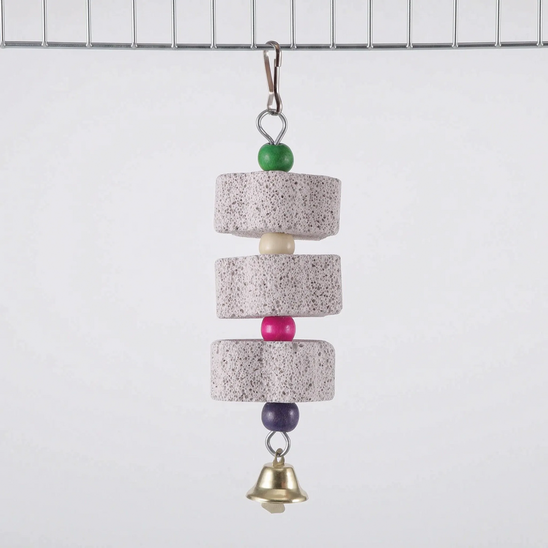 Version with three round stone discs separated by cream, pink and purple beads, topped with a green bead and finished with a bell, clipped to cage wire. 7