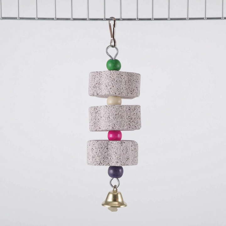 Version with three round stone discs separated by cream, pink and purple beads, topped with a green bead and finished with a bell, clipped to cage wire. 7