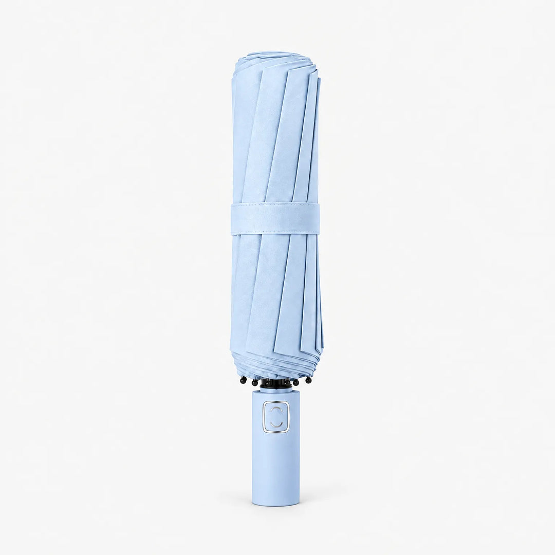 Folded light blue umbrella standing upright on a white background, held closed by a fabric strap. 6