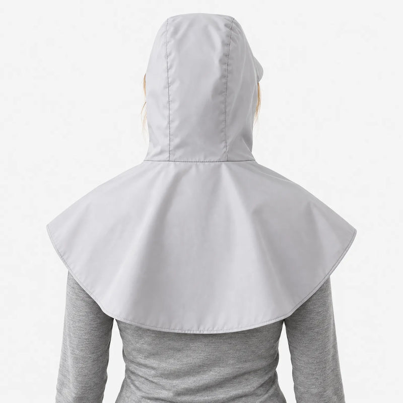 Back view of a light grey hooded cape with a wide rounded shoulder cover, worn over a grey long-sleeve top. 4
