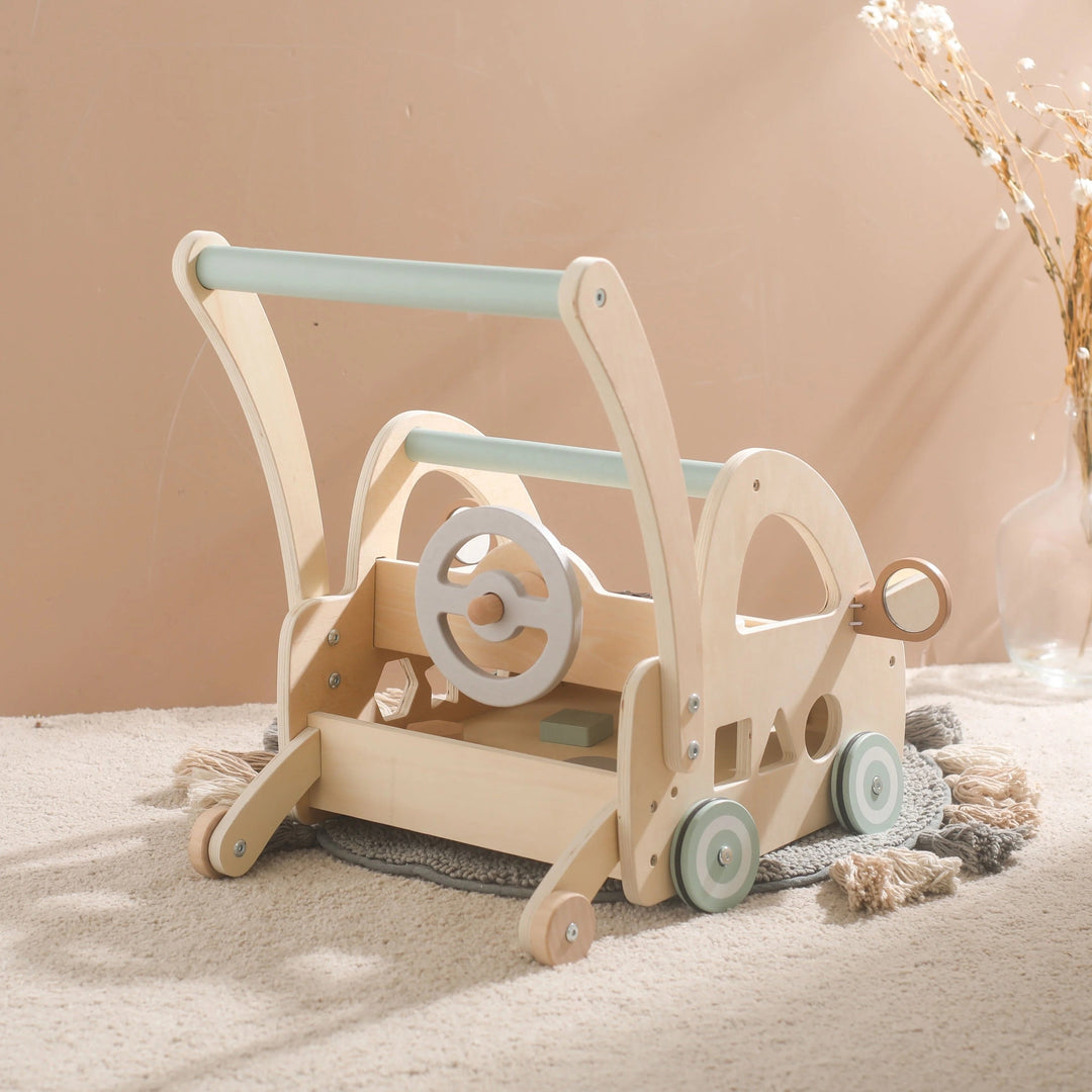 Wooden push-along walker with Montessori play components and mirrors.