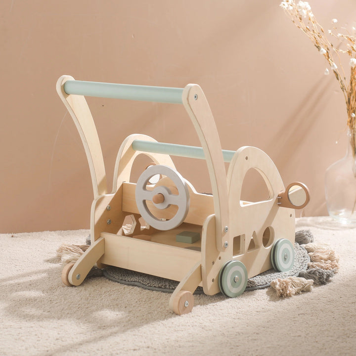 Wooden push-along walker with Montessori play components and mirrors.