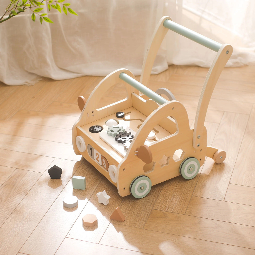 Wooden push-along walker with Montessori play components and mirrors.