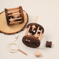 Wooden puzzle with basic shapes for children – learning game to develop motor skills