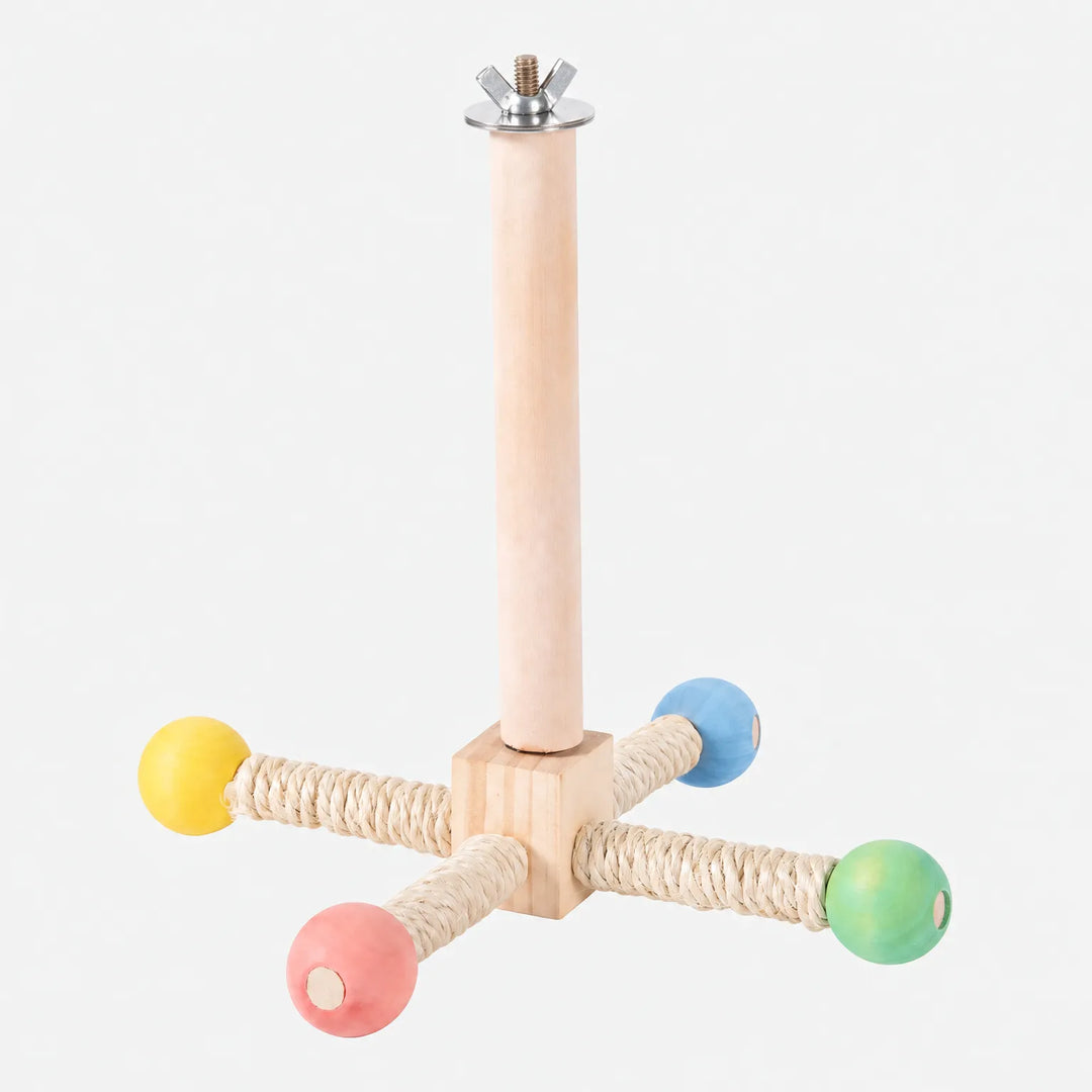 Wooden bird perch with four sisal-wrapped arms ending in yellow, blue, green and pink beads, with a wing nut fixing on top, on white. 1