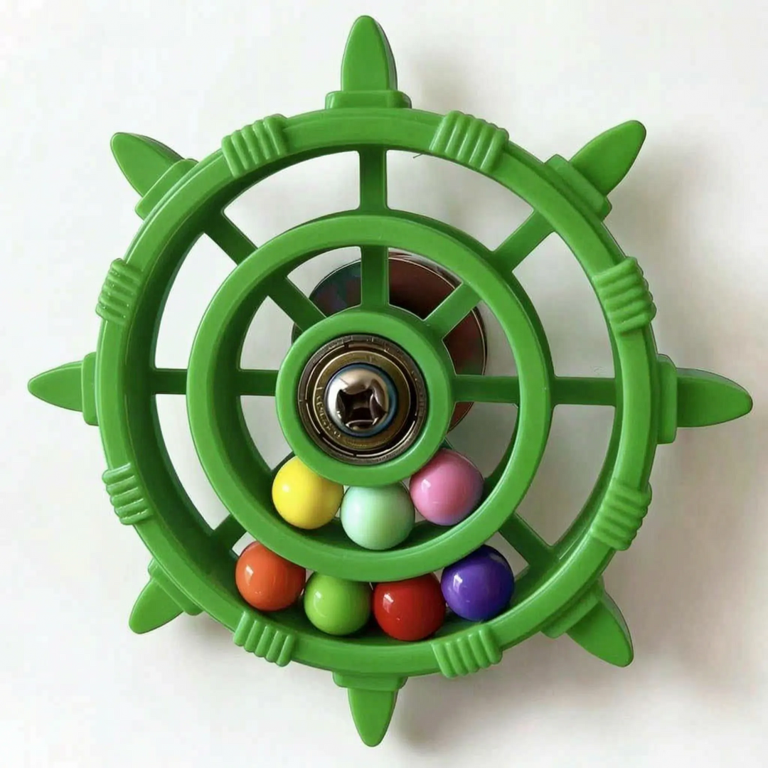 Green version of the wheel toy with a metal bearing hub and seven coloured balls in the lower rings. 7