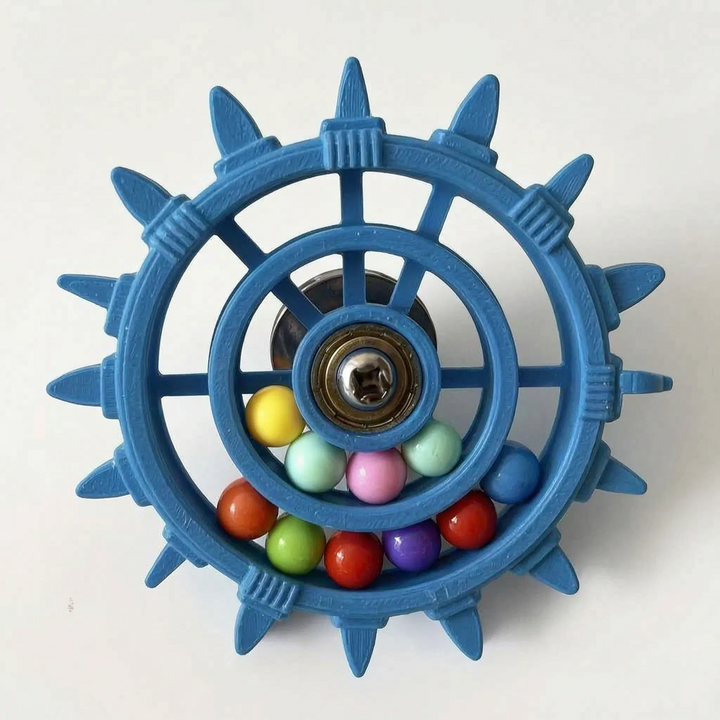 Blue version of the wheel toy with a larger rim of twelve spikes, a central bearing and a dozen coloured balls. 8