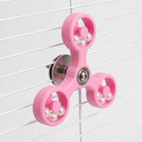 Pink version of the spinner toy mounted on white cage bars, showing the steel washer, nut and bolt behind. 5