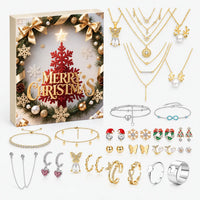 Cream wreath-design Christmas box with its contents laid out: layered gold necklaces, bracelets, festive earrings, ear cuffs and silver and gold rings. 6