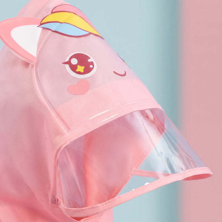 Close-up of the pink unicorn hood with ears, rainbow horn, big eyes and a transparent visor brim. 6