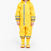 Front view of a child in the yellow hooded rain jumpsuit with grey reflective stripes, snap buttons, elastic cuffs and giraffe boots. 2