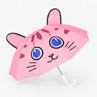 Pink umbrella with a cat face, blue eyes, whiskers and two black-edged ears, shown open on a plain white background. 2